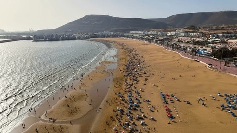 Agadir's stunning Taghazout beach with calm waters and golden sand