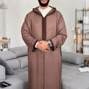 Modern djellaba design featuring traditional embroidery and patterns