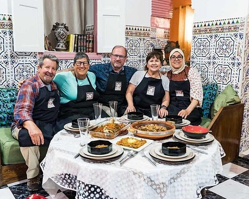 A workshop on traditional bread making and Four Beldi maintenance, with participants gathered around a table