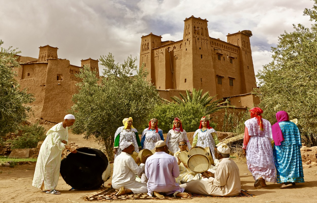 A Gnawa musician playing a traditional instrument, showcasing the rich cultural heritage of Morocco