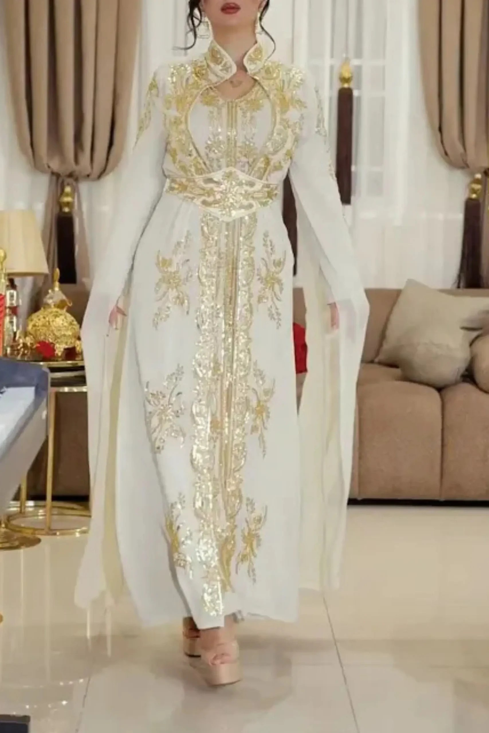 Modern Moroccan bride wearing a stunning caftan with intricate embroidery