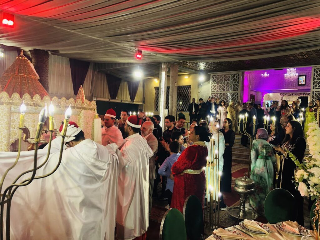Intricately decorated Moroccan wedding hall with bright colors and traditional elements