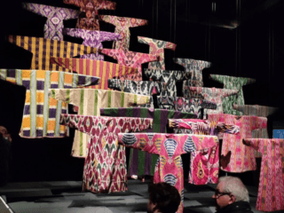 Richly embroidered textile with intricate patterns and colors