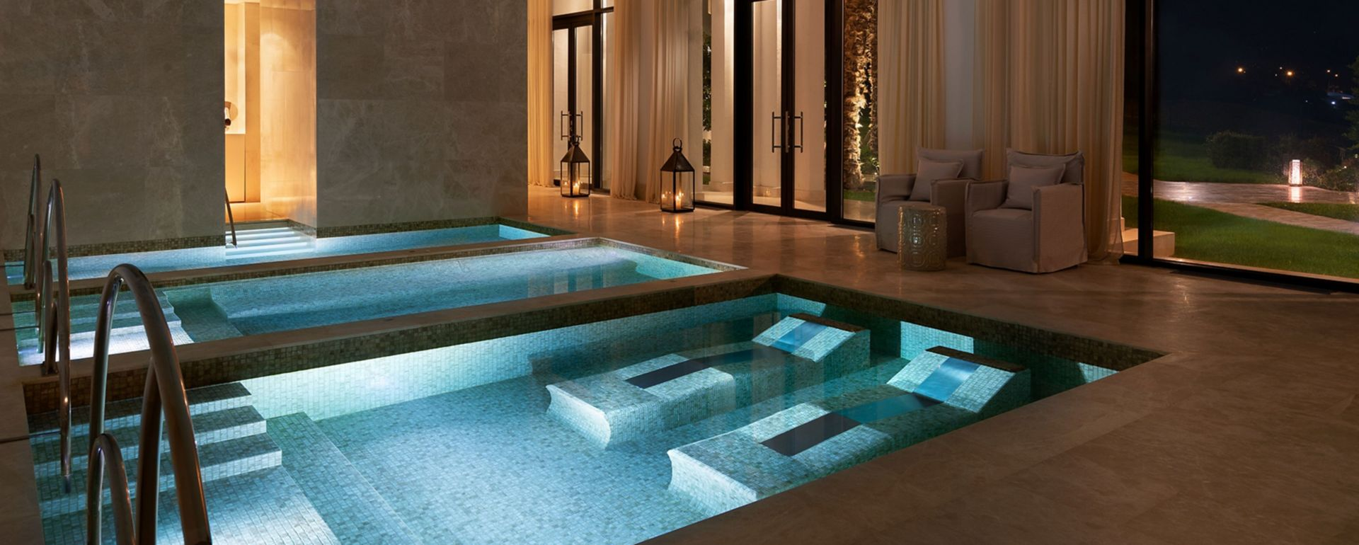 A serene interior of a traditional Moroccan hammam, adorned with intricate tiles and steam-filled atmosphere